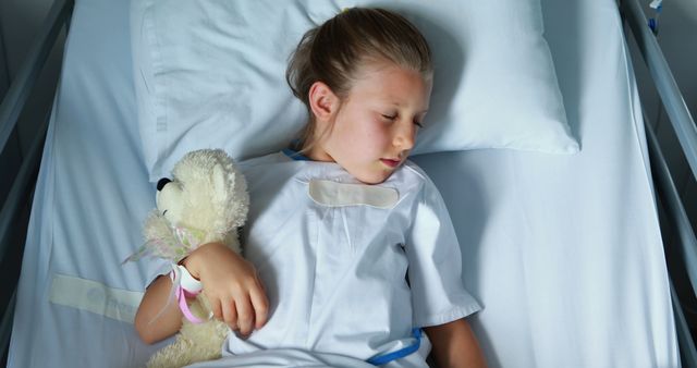 Young Girl Sleeping in Hospital Bed Holding Teddy Bear - Download Free Stock Images Pikwizard.com