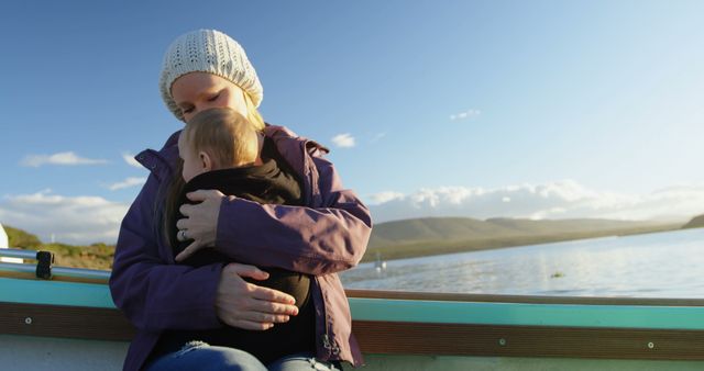 Mother and Baby Enjoying Calm Lake on Boat Ride - Download Free Stock Images Pikwizard.com