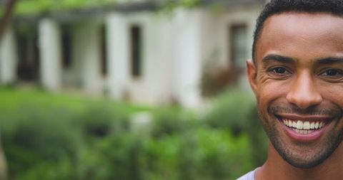 Happy Man Standing Outdoors Near Home