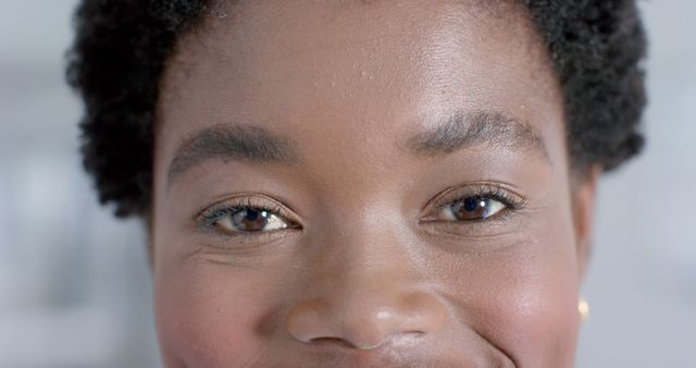 Close-up of Smiling African American Woman's Face with Focus on Eyes - Download Free Stock Images Pikwizard.com