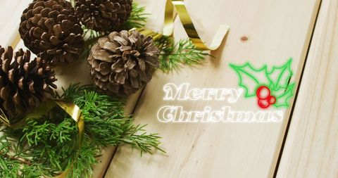 Festive Pinecones and Merry Christmas Greeting on Wooden Table - Download Free Stock Images Pikwizard.com