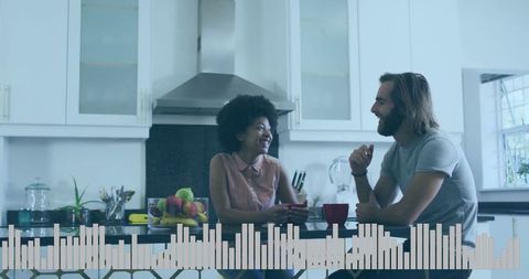 Couple enjoying morning coffee and conversation in cozy kitchen