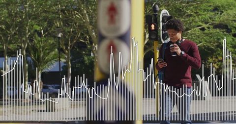 Man Commuting with Coffee and Smartphone on City Street