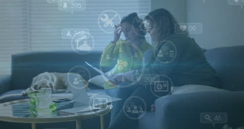 Lesbian Couple Relaxing at Home, Engaging with Digital Media