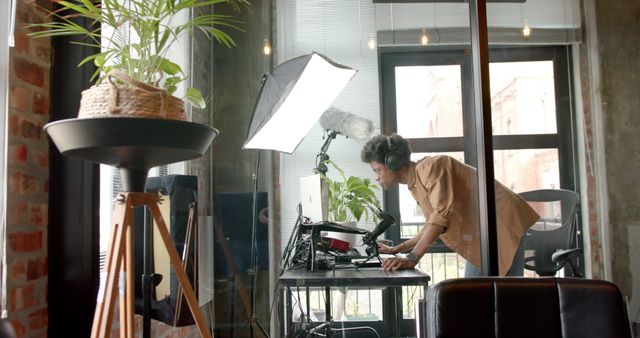 Professional Podcaster Setting Up Recording Equipment in Modern Studio - Download Free Stock Images Pikwizard.com