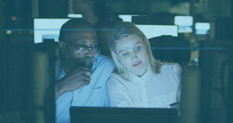 Team Collaborating During Late Night Office Environment