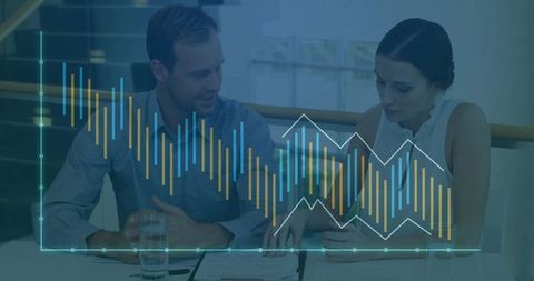 Business Partners Reviewing Data Dashboard on Tablet with Financial Charts Overlay