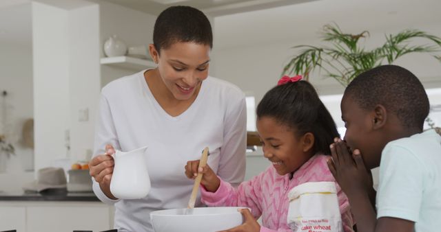 Mother Baking with Children in Bright Modern Kitchen - Download Free Stock Images Pikwizard.com