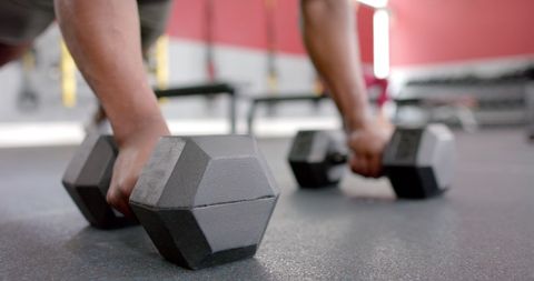 Close-Up of Person Gripping Heavy Dumbbells in Gym Workout - Download Free Stock Images Pikwizard.com