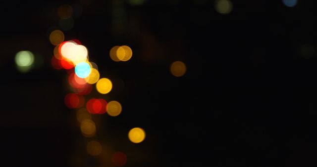 Abstract bokeh city lights in various colors create a dreamy, artistic vibe. Perfect for use in backgrounds, promotional materials, websites, and social media graphics. Ideal for designers seeking a vibrant, urban aesthetic.