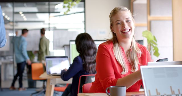 Young Professional Female Smiling and Collaborating in Modern Office - Download Free Stock Images Pikwizard.com