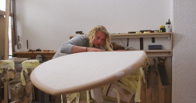 Skilled Artisan Crafting Surfboard In Workshop - Download Free Stock Images Pikwizard.com