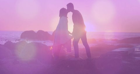 Silhouette of Couple Kissing at Magical Seaside