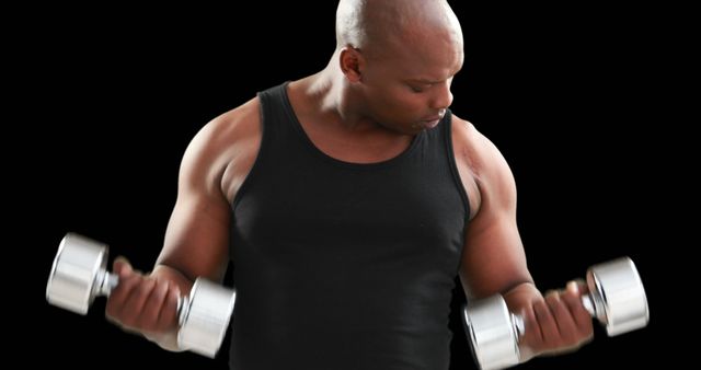 Determined Man Lifting Dumbbells for Strength Training on Black Background - Download Free Stock Images Pikwizard.com