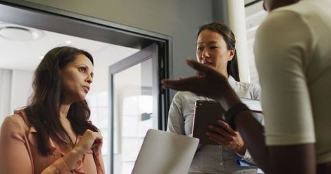 Collaborative Team Meeting in Modern Office Space