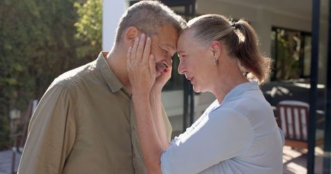 Senior Couple Embracing Outdoors Showing Intimacy and Connection