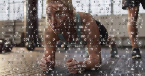 Woman holding forearm plank with binary overlay merging fitness and technology