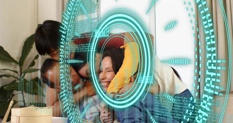 Multigenerational family hugging on couch with teal augmented reality hud overlay