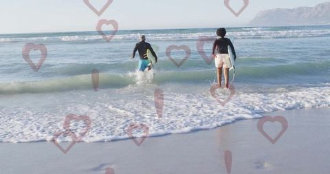Surfers embracing ocean adventure with love