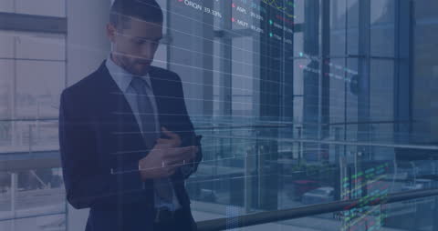 Businessman Analyzing Financial Data on Smartphone in Modern Office