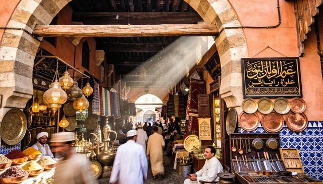 Sunlit souk with brass lanterns, copperware, spices, colorful rugs and busy vendors