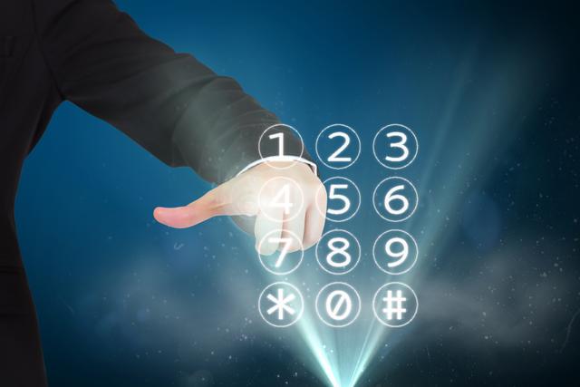 Businessman touching a virtual numeric keypad on a digital interface, symbolizing technology and innovation. Suitable for use in financial technology, security systems, or futuristic themes conveying interaction with advanced technological interfaces.