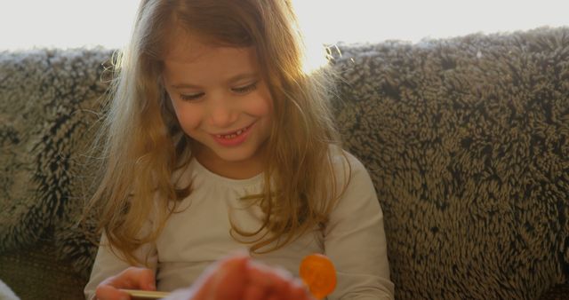 Happy Young Girl Playing with Toy in Cozy Home Setting - Download Free Stock Images Pikwizard.com