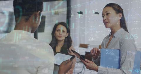 diverse businesswomen discussing strategies with financial data overlay - Download Free Stock Images Pikwizard.com