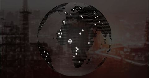 Futuristic dotted globe over industrial landscape at night