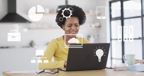 African American Woman Working Remotely from Home Kitchen