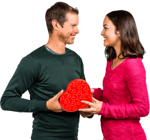 Joyful Romantic Couple with Heart-shaped Gift Exchanging Smiles Transparent Love
