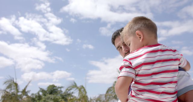 Father Holding Son Outdoors on a Sunny Day - Download Free Stock Images Pikwizard.com