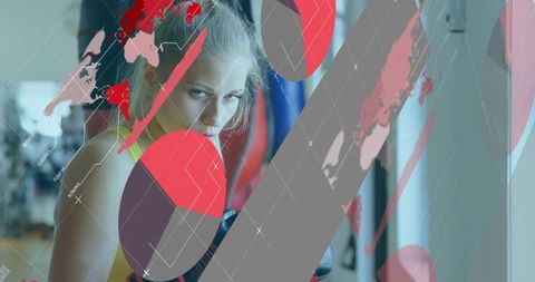 Female boxer leaning on heavy bag, focused gaze with red graphic overlay and world map