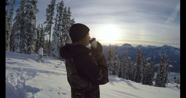 Winter Hiker Drinking Hot Beverage in Snowy Mountain Landscape at Sunrise - Download Free Stock Images Pikwizard.com