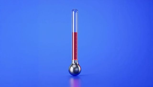 Standing thermometer with red fluid on blue background