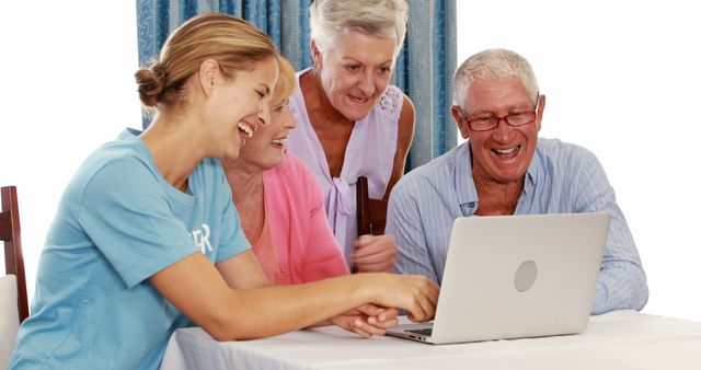 Young Woman Teaching Senior Friends Laptop Usage - Download Free Stock Images Pikwizard.com