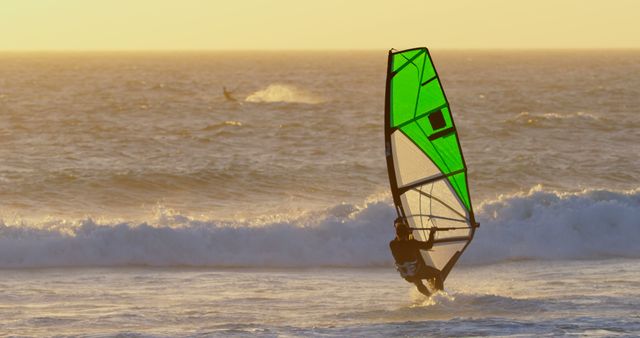 Windsurfer Riding Waves at Sunset - Download Free Stock Images Pikwizard.com