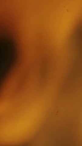 Vertical amber blur flowing softly for ambient minimalist background video loop