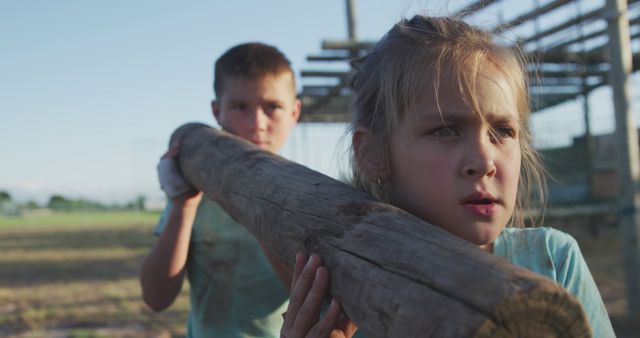 Children Carrying Wooden Log in Outdoor Setting - Download Free Stock Images Pikwizard.com