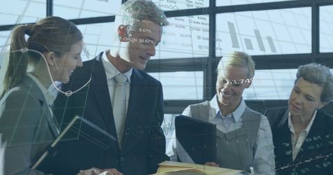 Business Team Analyzing Financial Data Graphics in Office