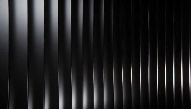 Glossy black vertical slatted panels reflecting light with metallic highlights modern