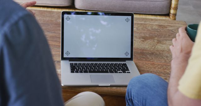 Two People Discussing Work on Open Laptop with Blank Screen - Download Free Stock Images Pikwizard.com