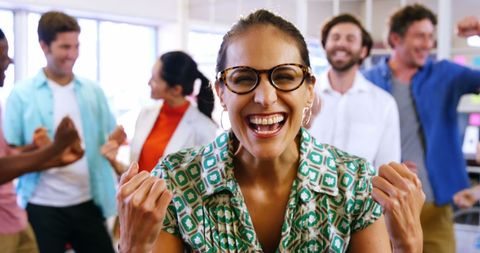 Diverse team celebrating success with joyful enthusiasm
