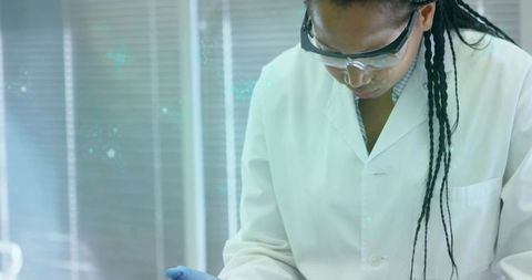 Technician in lab coat conducting scientific research