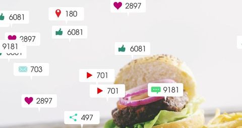 Showing social media engagement bubbles over gourmet burger with fries and sesame bun