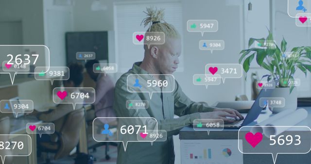 Man in a modern office space is working on his laptop, surrounded by social media engagement icons such as likes, comments, and follower counts. This visual can be useful for portraying digital engagement, influencer marketing, social media management, and tech-savvy work environments.