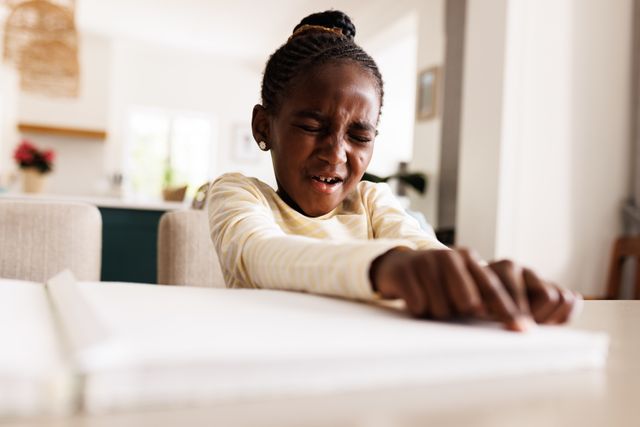 African American Girl Reading Braille Book at Home - Download Free Stock Images Pikwizard.com