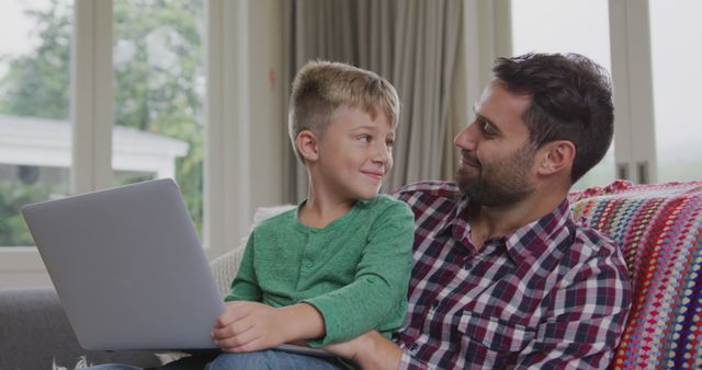 Father and Son Enjoying Time Together with Laptop at Home - Download Free Stock Images Pikwizard.com