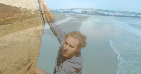 Man climbing coastal cliff embracing nature adventure