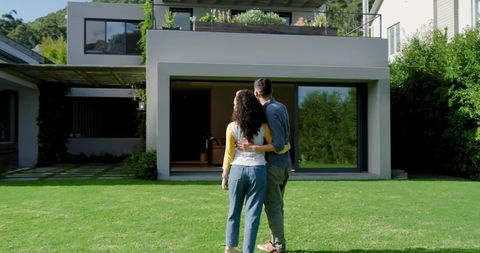Couple Admiring Modern House with Spacious Yard